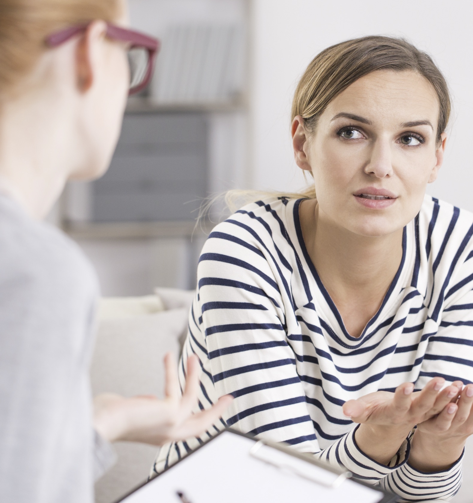 Options Information A woman receiving pregnancy option information in Dubuque, Iowa