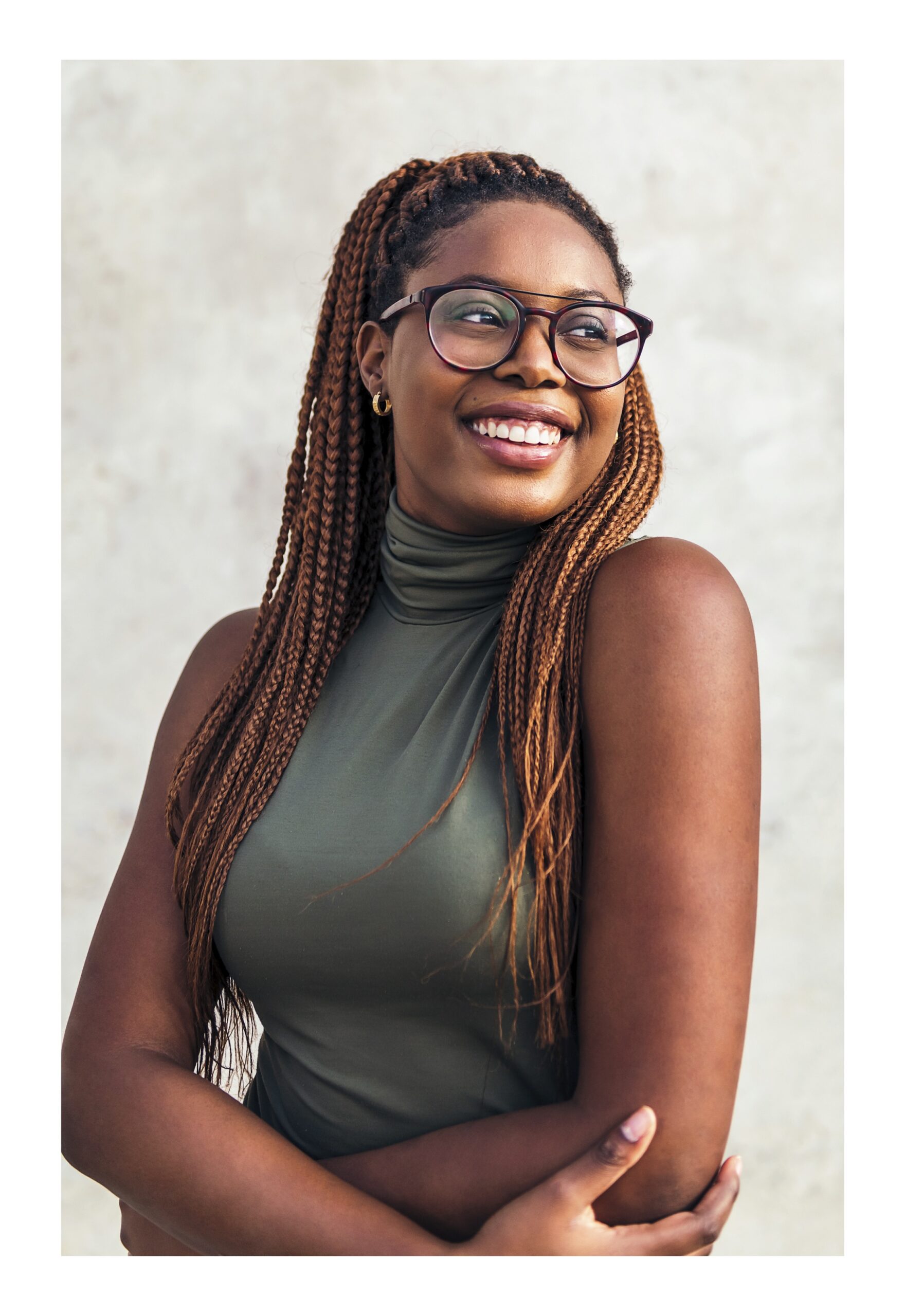 Get the Support You Deserve A woman smiling because she knows she can get pregnancy support at Clarity Clinic